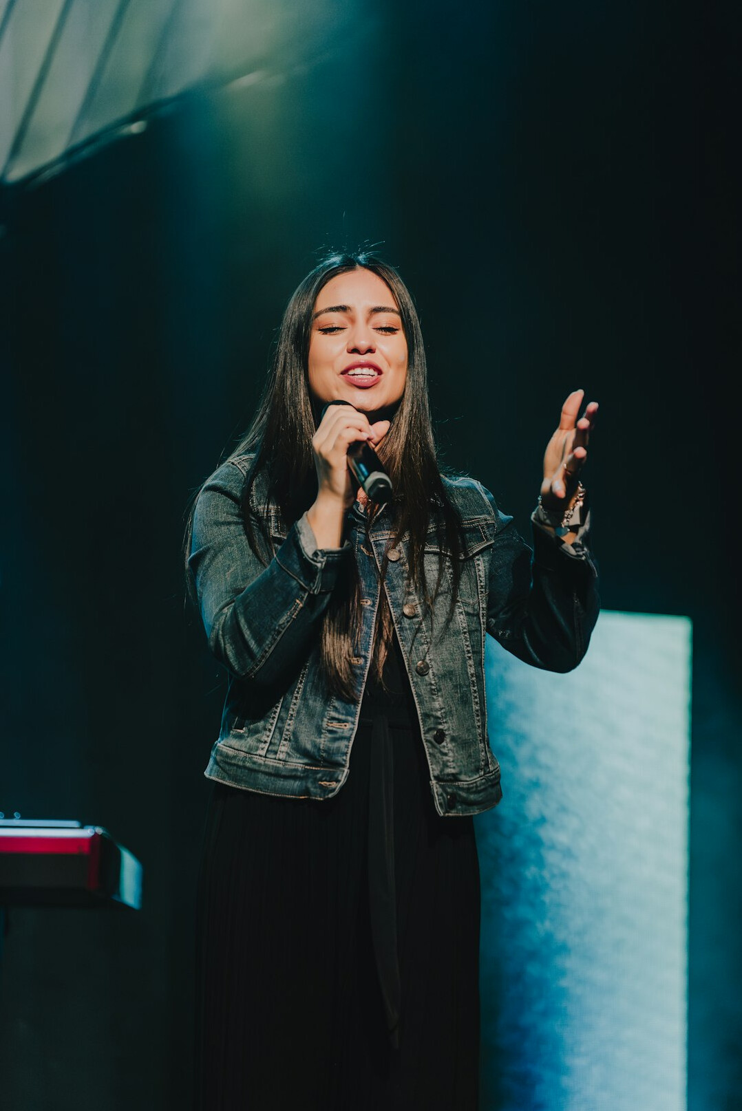 confident woman speaking on stage